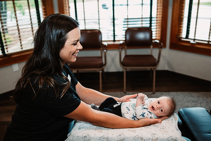 Chiropractor West Bend WI Baby On Table